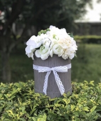 Caixa de flor redonda de papel com alças